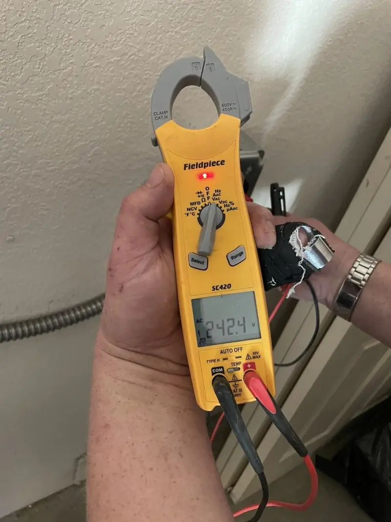 Voltage testing with clamp meter during Electrical Installation Services in Baltimore